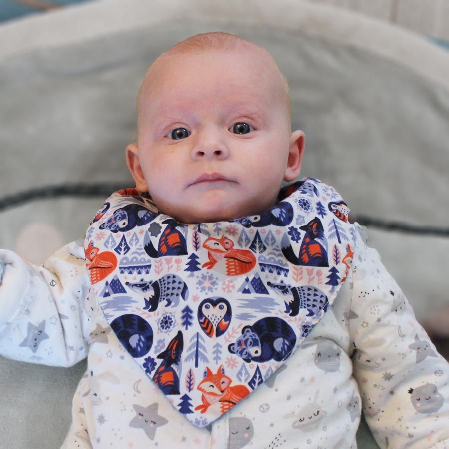 Baby wearing a bib made of Organic cotton poplin