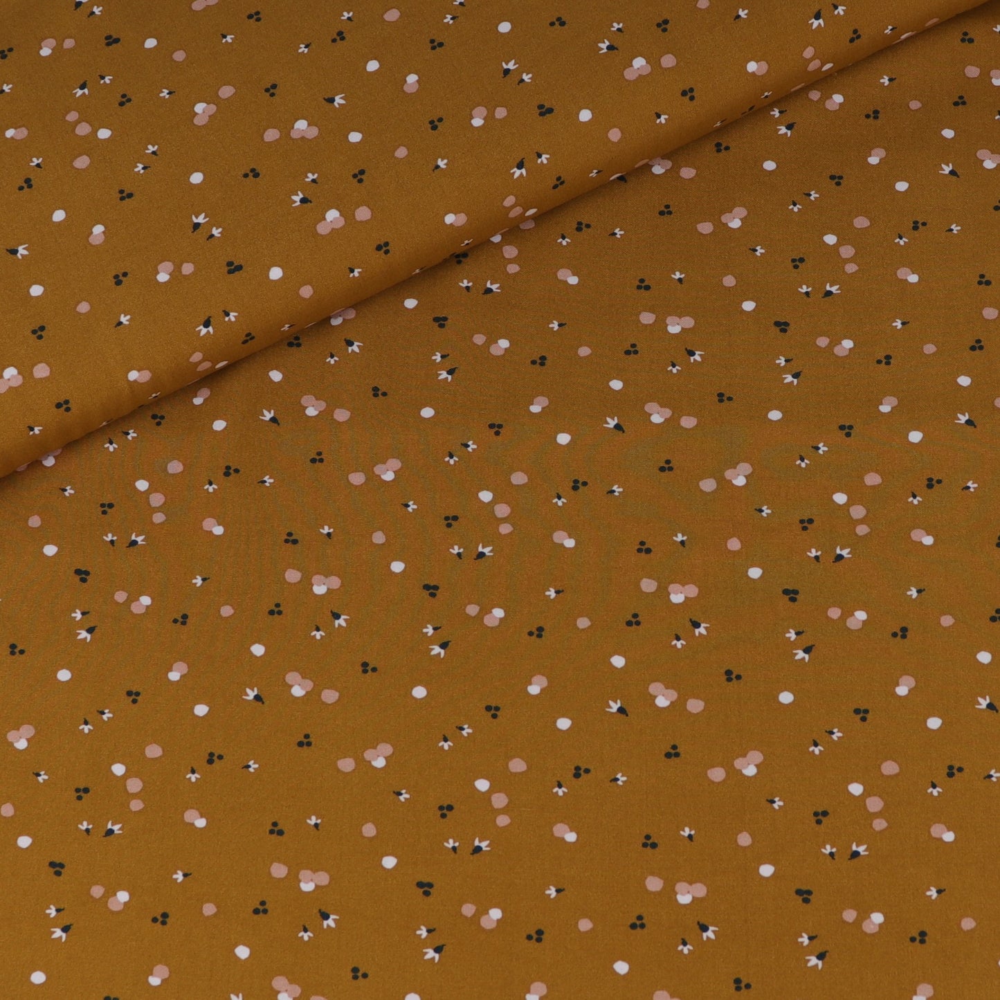 Ochre fluid viscose with abstract white and light pink pattern