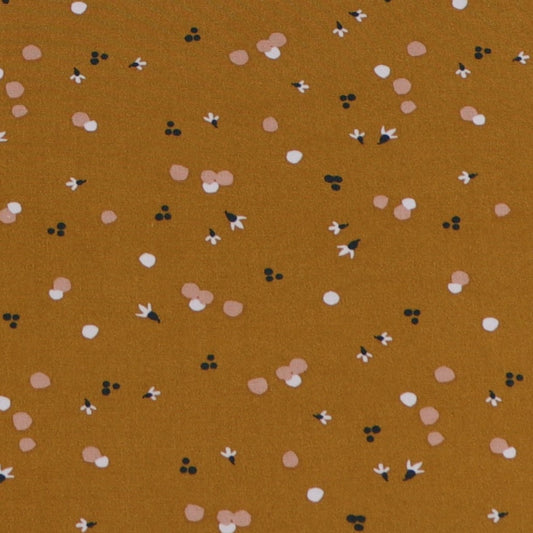 Ochre fluid viscose with abstract white and light pink pattern